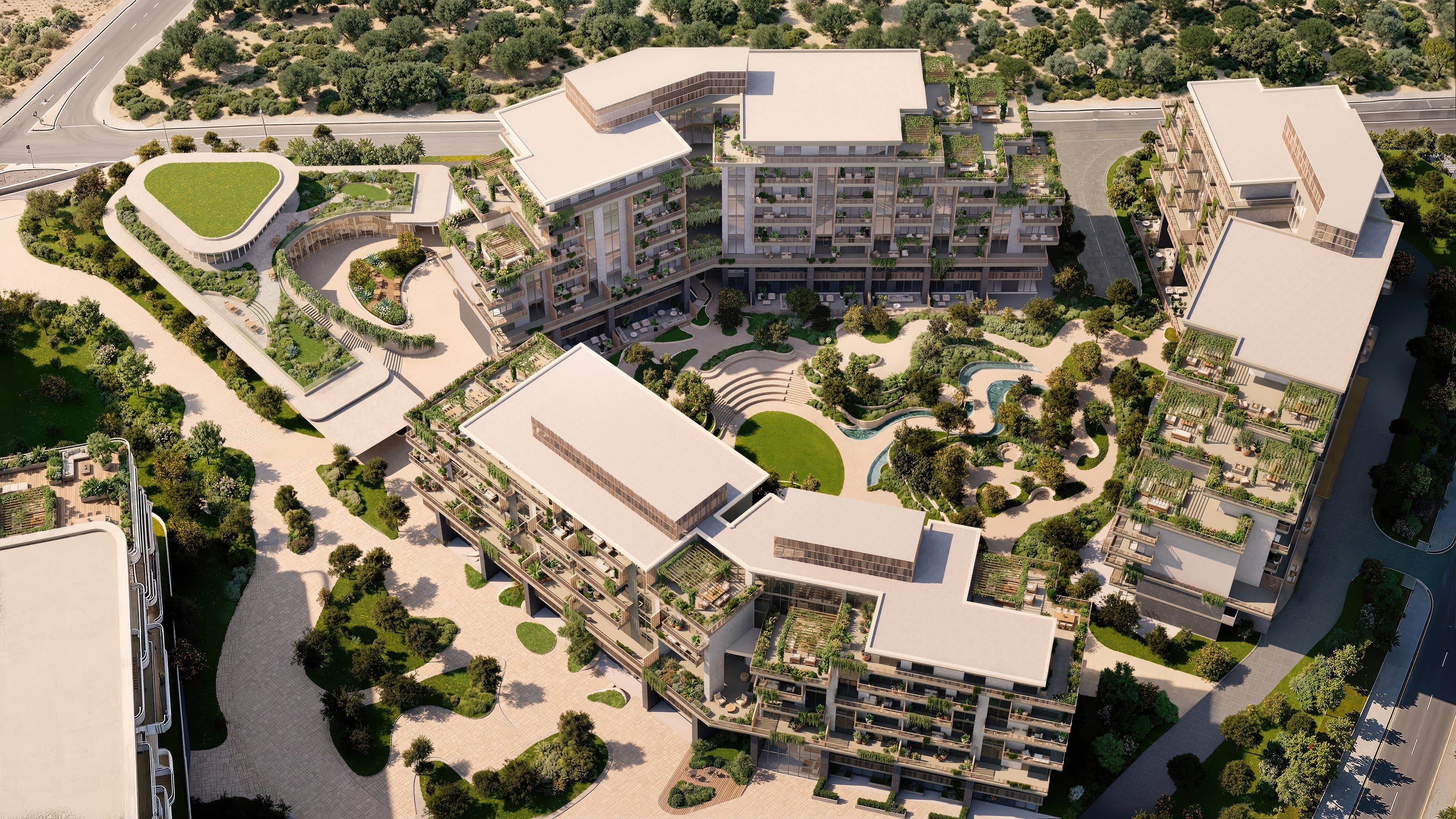 Aerial view of the Arancia Yards 2 courtyard, with a lawn, pool, and planted roofs.
