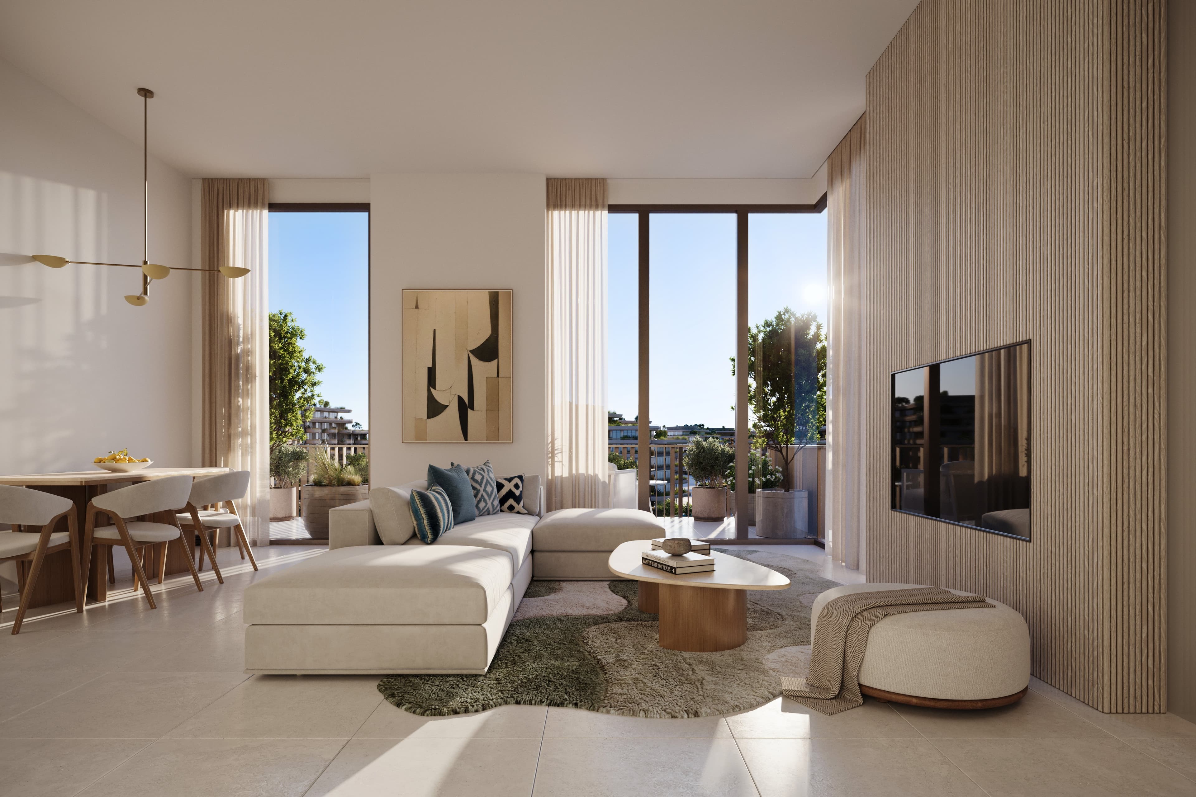 A living room at Arancia Yards 2 opening onto a terrace, with the dining area to one side.
