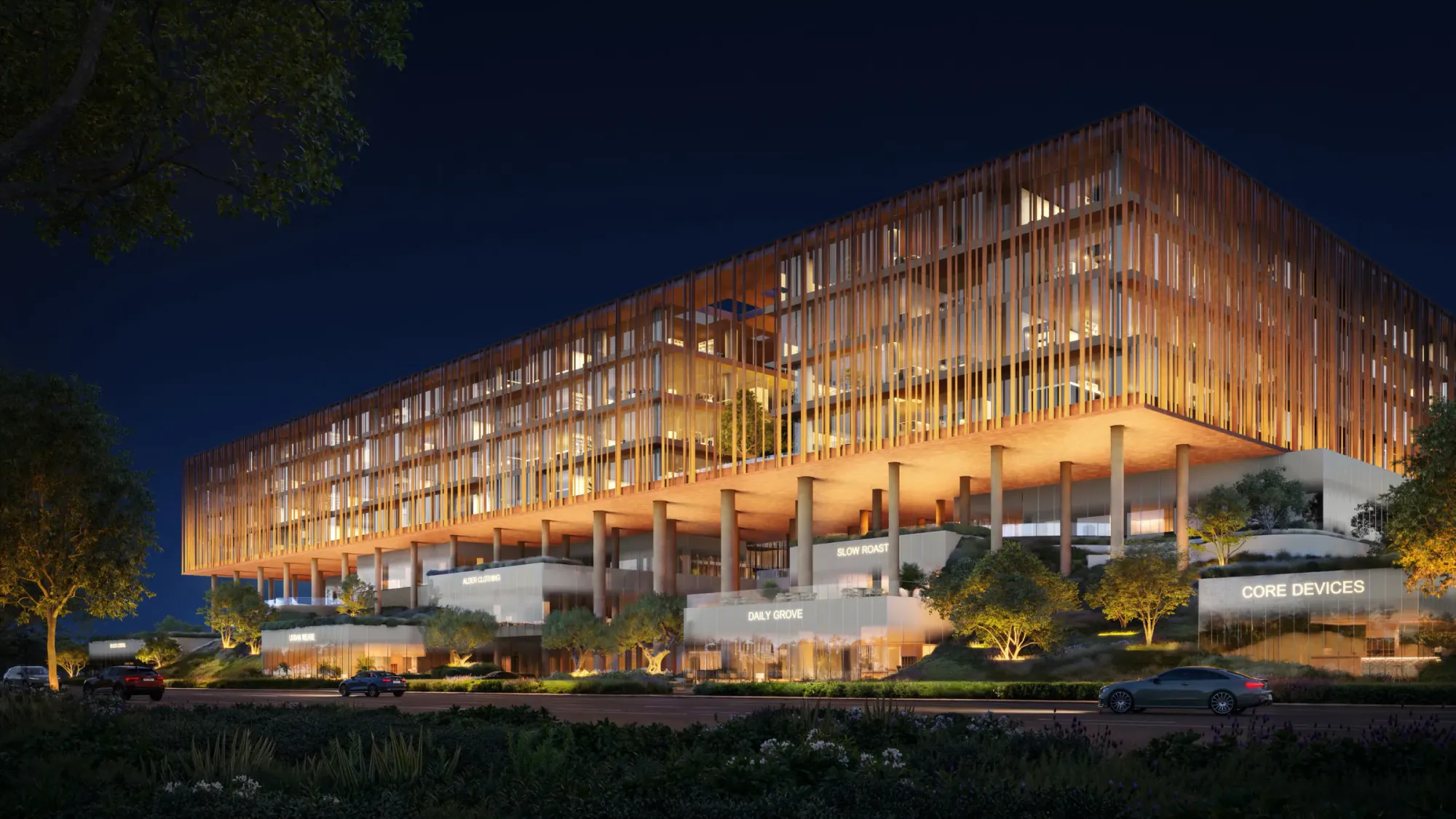 The Yards Plaza commercial offices and retail frontage illuminated at night